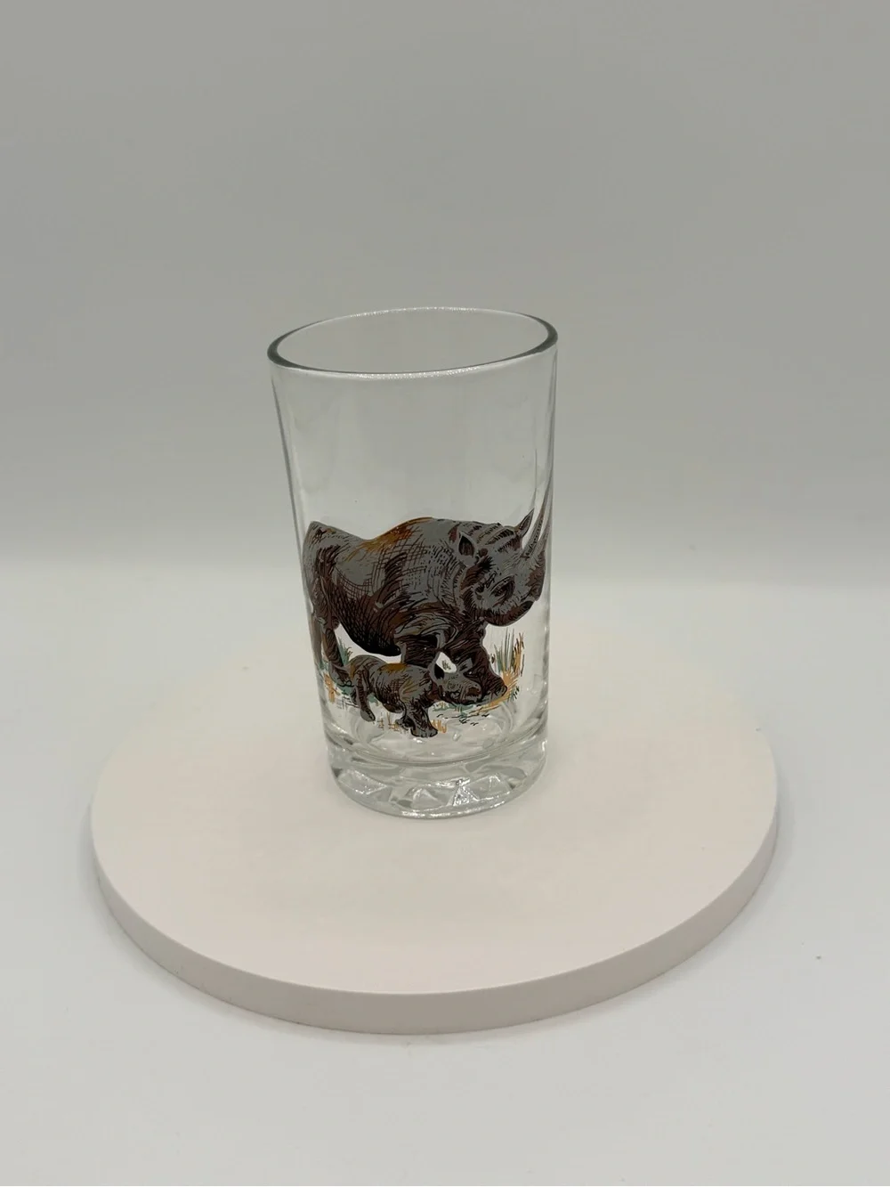 Set of five vintage Pasari glass tumblers with African wildlife decals.